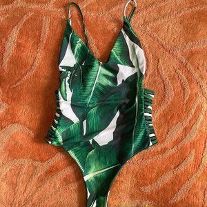 Tropical one piece with caged sides